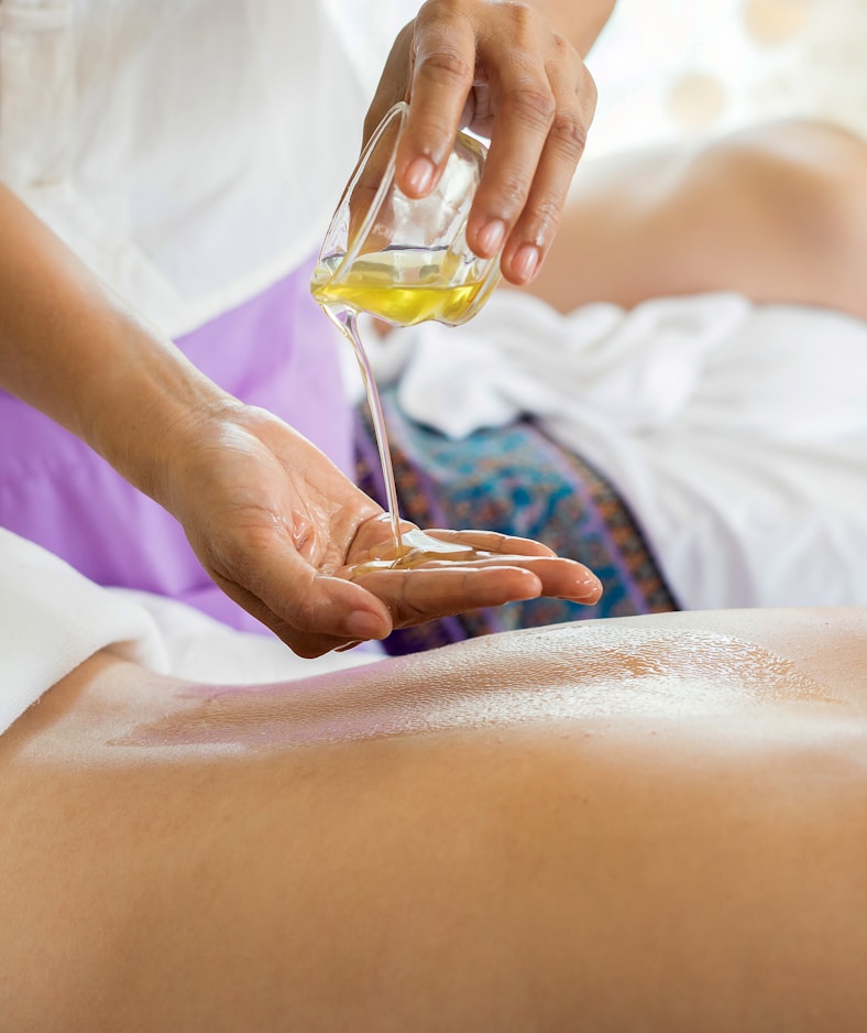 Spa treatment room with candles and towels