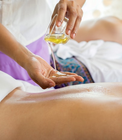 Woman receiving a relaxing back massage at a spa