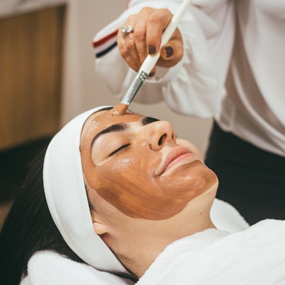 Luxury facial treatment with skincare products applied to the face